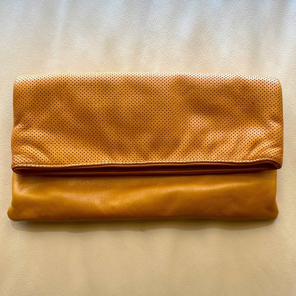 Oliveve Anastasia clutch in tan perforated leather